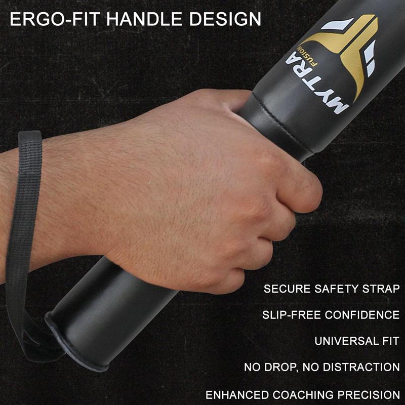 Hand holding a black training aid with 'Matrix' branding, featuring ergonomic handle design on a dark background.